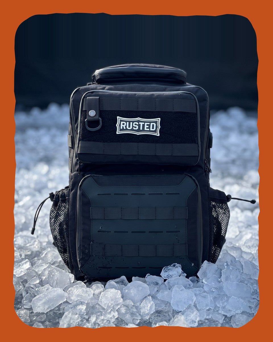 RUSTED Crew Pack 35L insulated cooler backpack sitting on a bed of ice