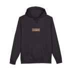 TRUST THE RUST chest badge on a black hoodie