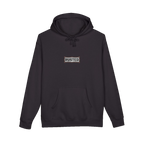TRUST THE RUST chest badge on a black hoodie