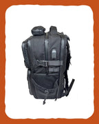 RUSTED Crew Pack side view showing depth, USB port and compression strap