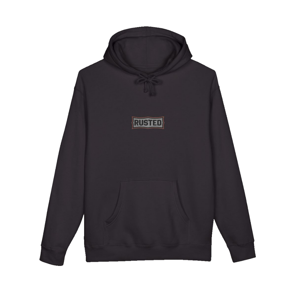 TRUST THE RUST chest badge on a black hoodie