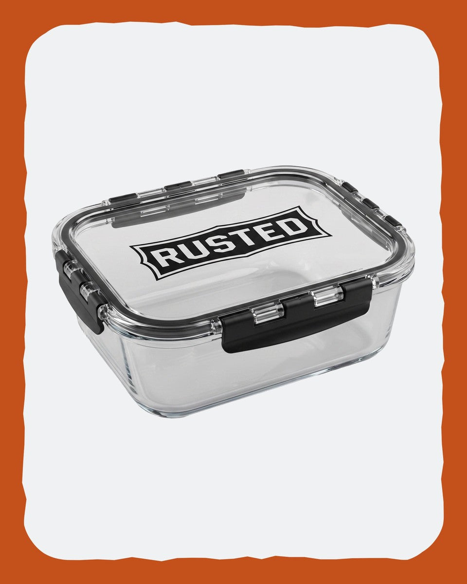 RUSTED Crew Container Large, three-quarter studio view showing the RUSTED banner on the lid