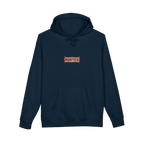 TRUST THE RUST chest badge on a navy hoodie