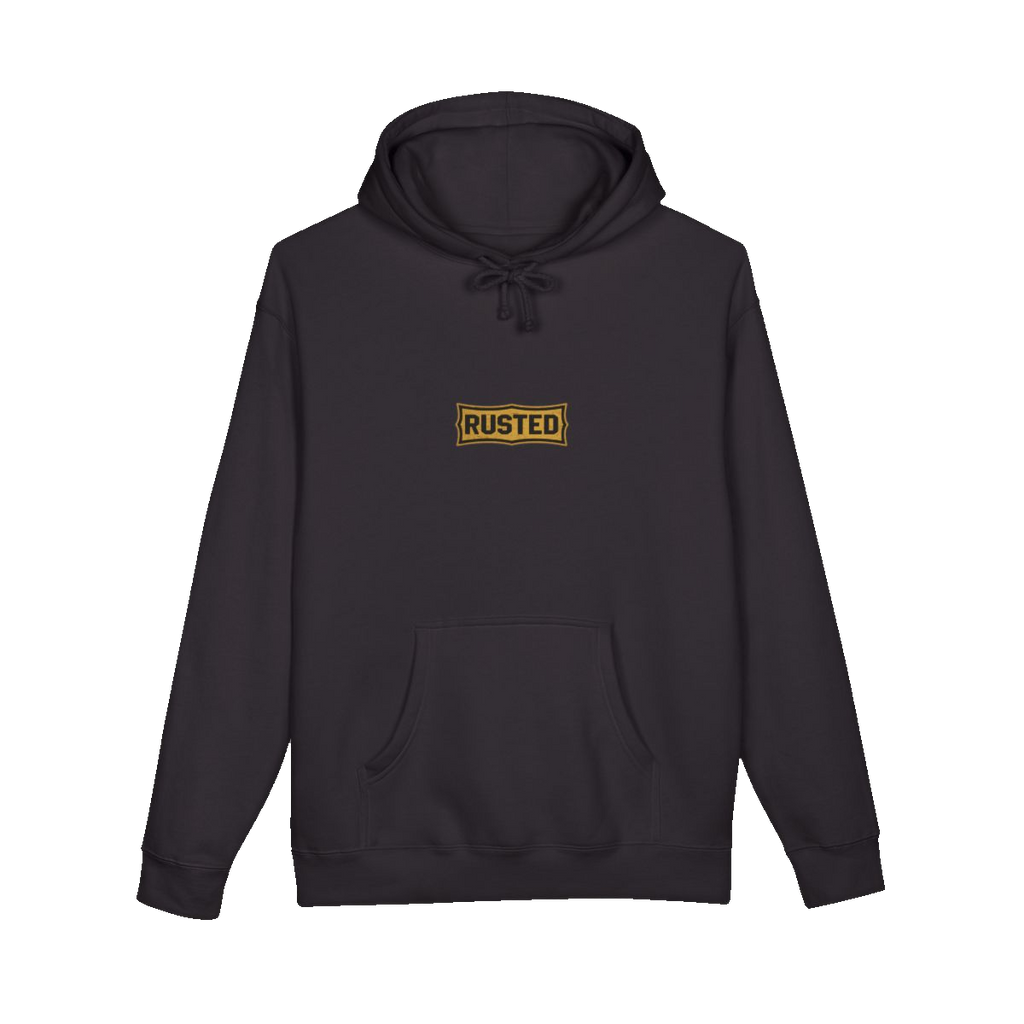 TRUST THE RUST chest badge on a black hoodie