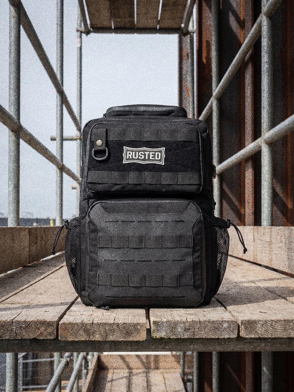 RUSTED Crew Pack on a scaffold plank deck