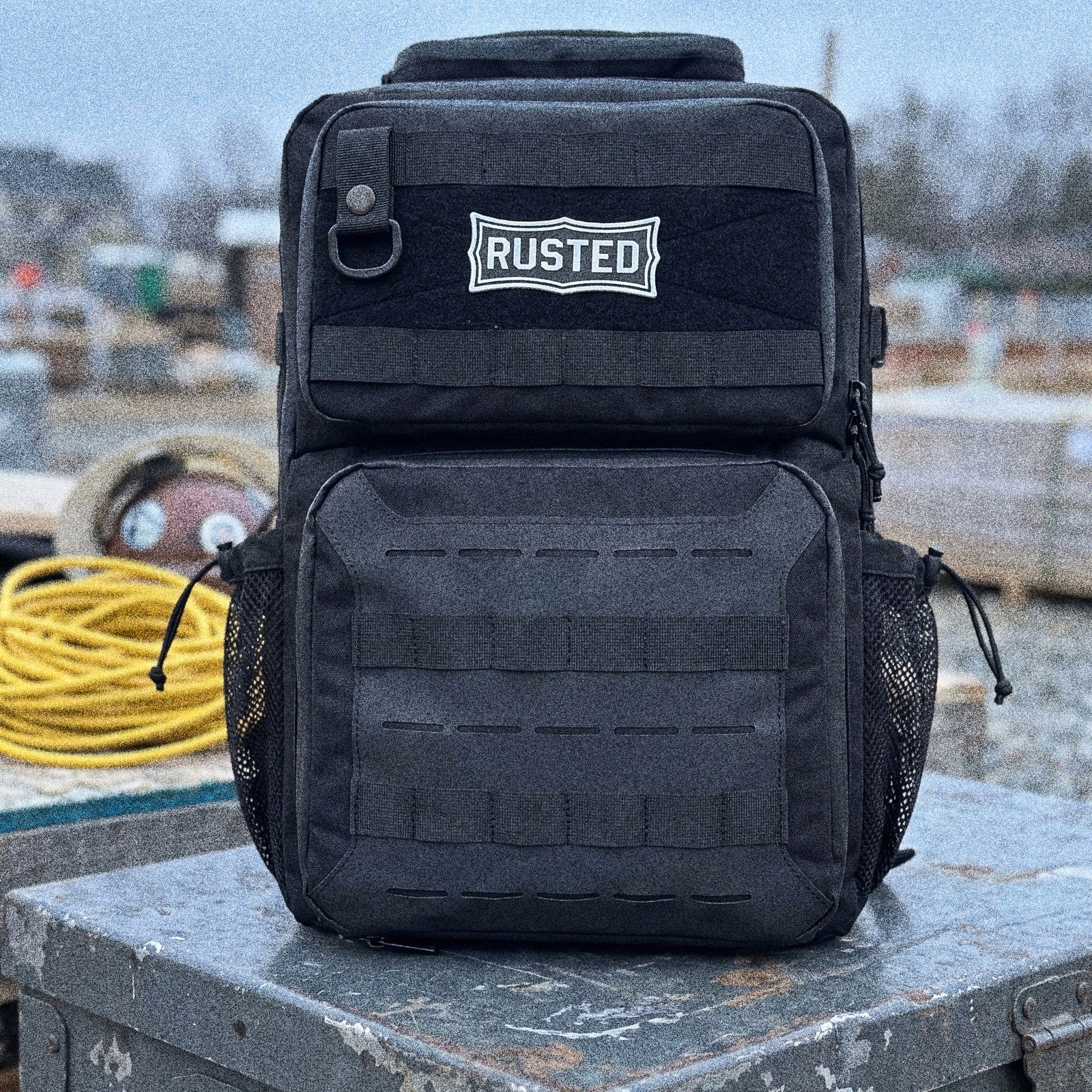 RUSTED Crew Pack 35L insulated cooler backpack on a steel gang box at a job site