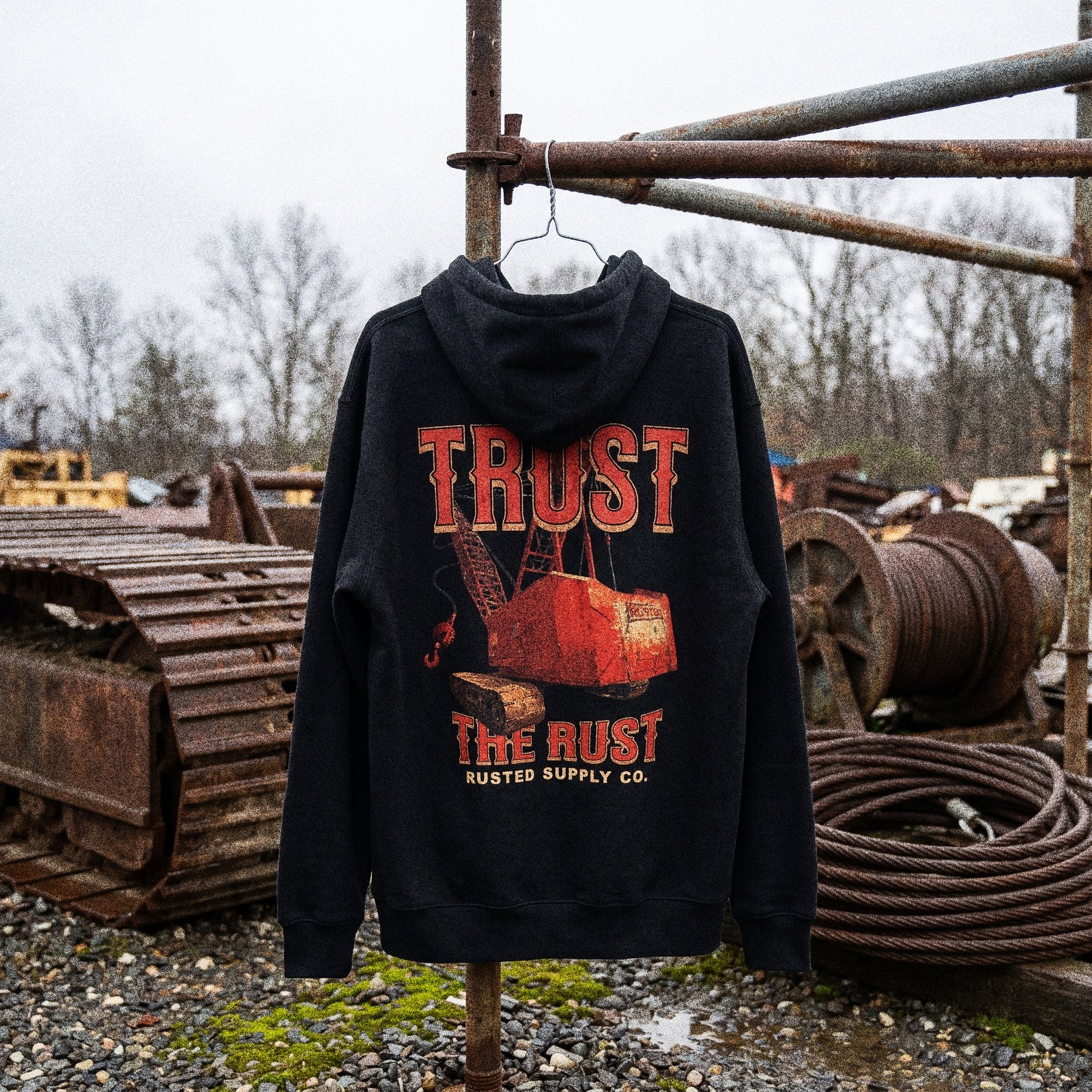 RUSTED hoodies hanging from a scaffold pipe