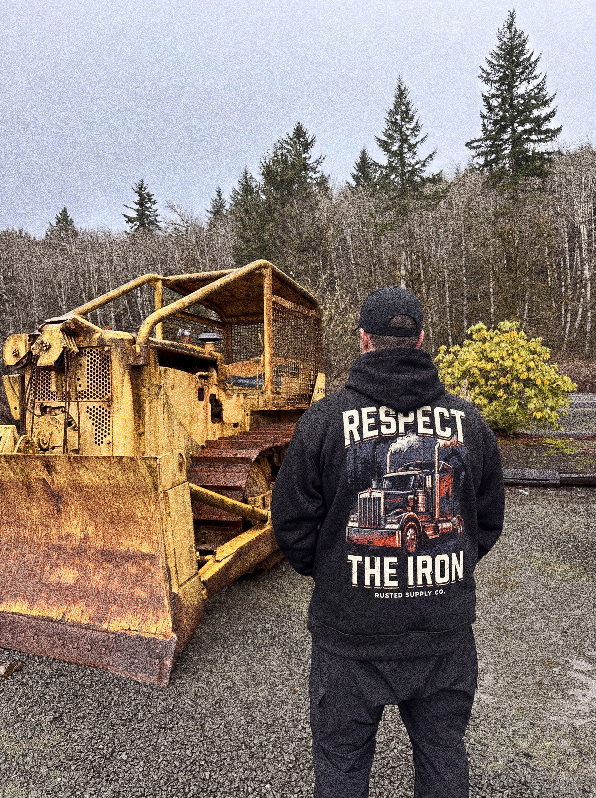 Operator wearing the RESPECT THE IRON conventional semi hoodie on a jobsite